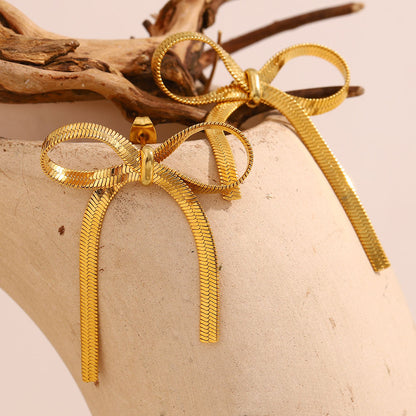 The Golden Ribbon Bow Studs